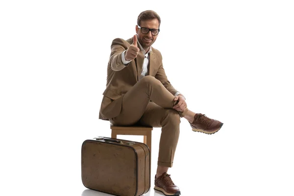 Sexy Businessman Giving Thumbs Chair Next Luggage Smiling Camera — стоковое фото