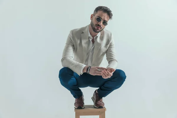 Sexy Bearded Businessman Untied Shirt Rubbing Palms Crouching Wooden Chair — Stockfoto