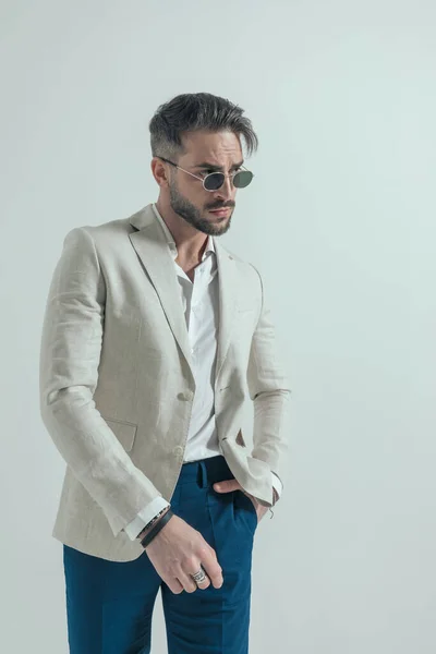 Portrait Sexy Bearded Guy Glasses Looking Side Holding Hand Pocket — Stockfoto