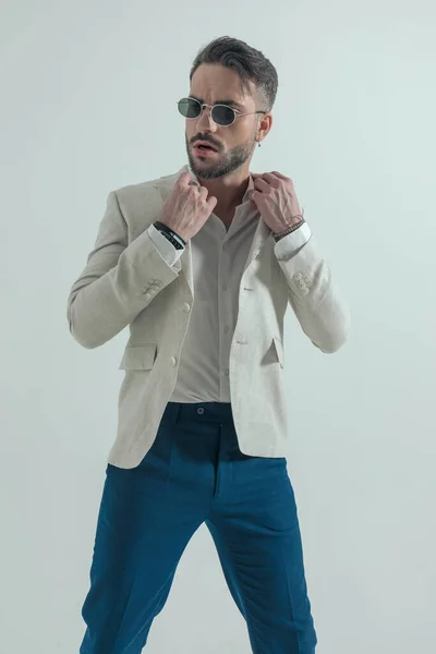 Handsome Bearded Man Glasses Adjusting Open Collar Shirt Looking Side — Stockfoto