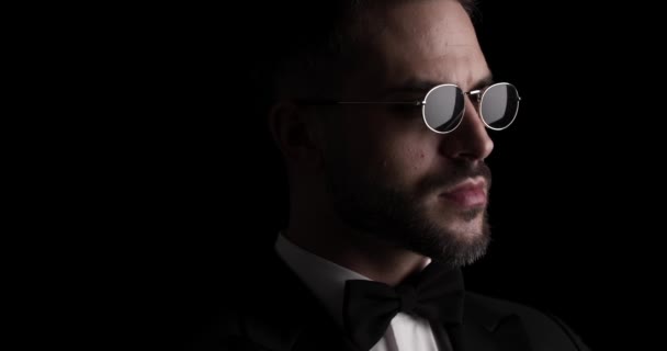 Close Video Sexy Man Sunglasses Tuxedo Looking Side Adjusting Bowtie — Stok video