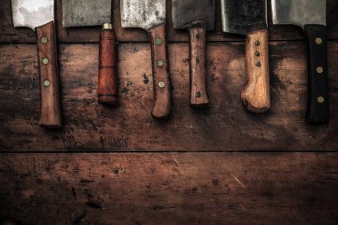 flat lay picture of old rustic meat butchers handles with blank copy space below for advertising and publicity 