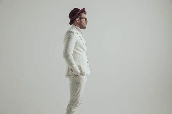 Side View Man White Outfit Hat Glasses Holding Hands Pockets — Photo