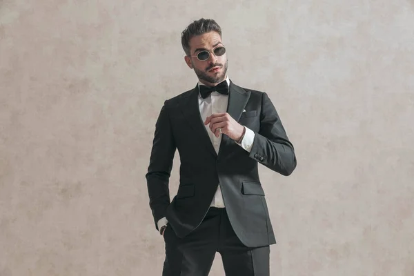 Attractive Young Guy Black Tuxedo Sunglasses Holding Hand Pocket Posing — 图库照片