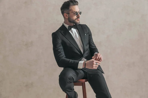 Cool Fashion Stylish Man Black Tuxedo Holding Elbow Knee Looking — Foto de Stock