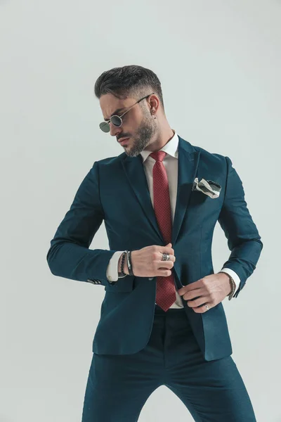Cool Young Man Suit Retro Sunglasses Adjusting Suit Looking Side — Stock Photo, Image