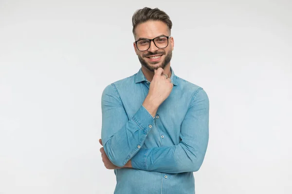 Young Casual Man Scratching His Chin Wearing Eyeglasses Giving Big — Stock Photo, Image