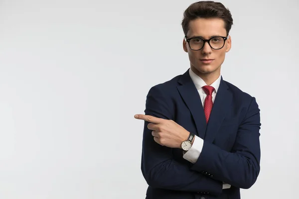 Picture Elegant Guy Glasses Navy Blue Suit Pointing Finger Side — Stock Photo, Image