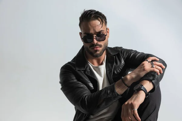 Sexy Modern Man Black Leather Jacket Sunglasses Posing Elbow Knee — Stock Photo, Image