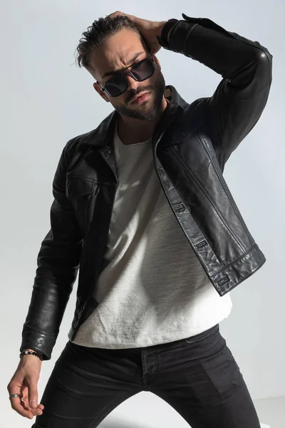 Sexy Fashion Man Wearing Sunglasses Black Leather Adjusting Hairstyle Posing — Stock Photo, Image