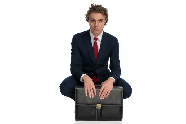 Sexy Young Man Elegant Suit Long Hair Crouching Next Suitcase — стоковое фото