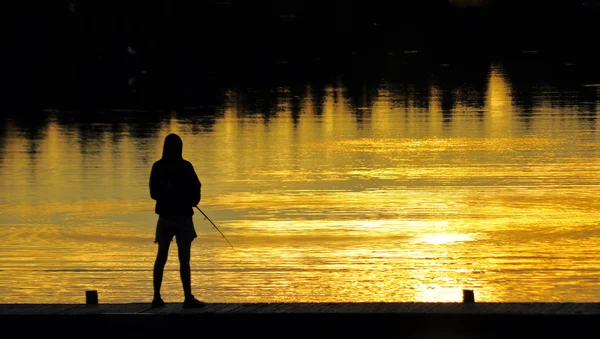 Fiske vid solnedgången — Stockfoto