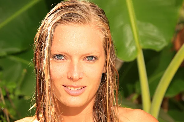 Woman in tropical shower palms around — Stock Photo, Image