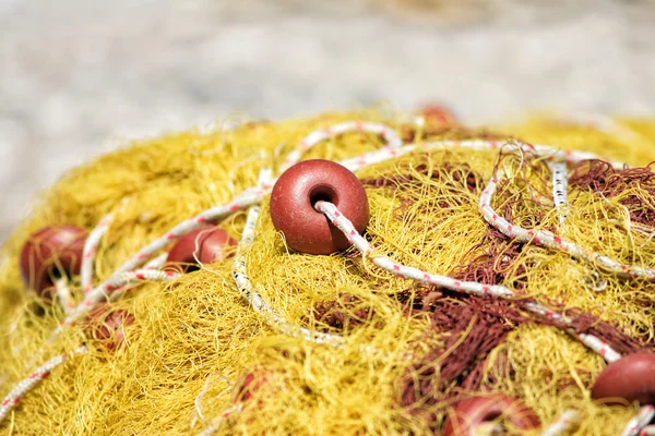 Old yellow fishing net — Stock Photo, Image