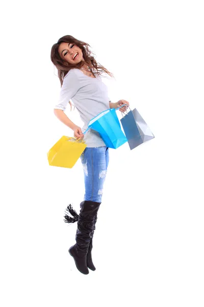 Nő gazdaság bevásárló táskák ellen fehér háttér — Stock Fotó