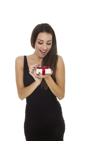 Woman holding gift box over white — Stock Photo, Image