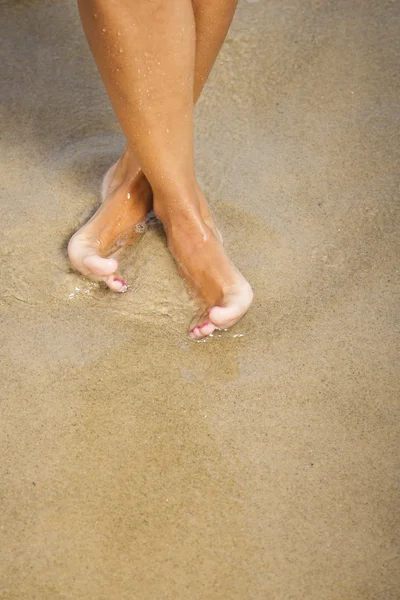 Nice legs of a girl walking in water — Stock Photo, Image