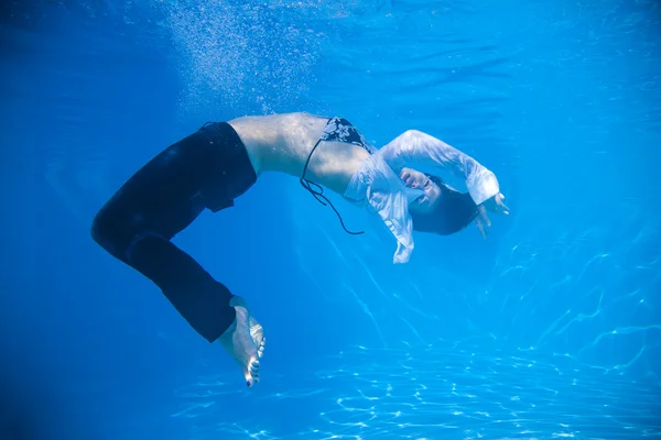 Woman wearing a jeans underwater — Stock Photo, Image