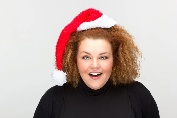 Beautiful young woman wearing a Santa hat — Stock Photo, Image