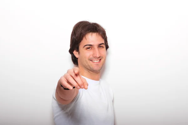 Young man against pink background — Stock Photo, Image