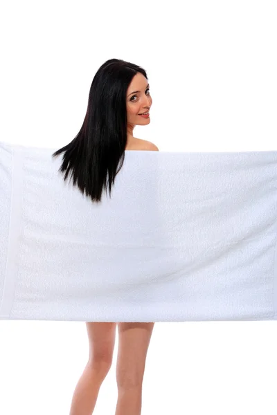 Vrouw onder handdoek — Stockfoto