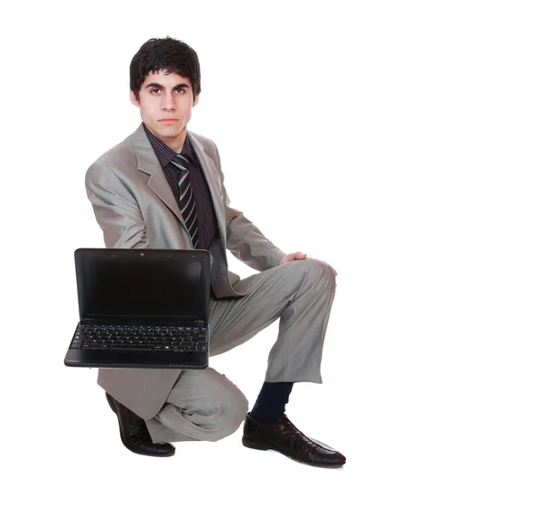 Homme d'affaires affichant un ordinateur portable — Photo