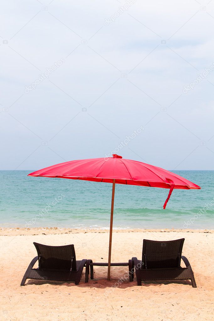 beds and umbrella on a beach