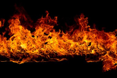 Blazing flames on black background clipart