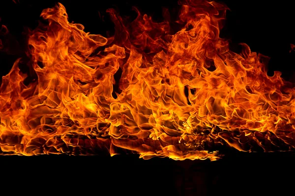 Blazing flames on black background — Stock Photo, Image