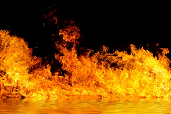 Blazing flames on black — Stock Photo, Image