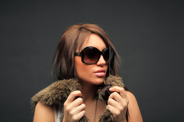 beautiful long hair brunette woman wearing sunglasses