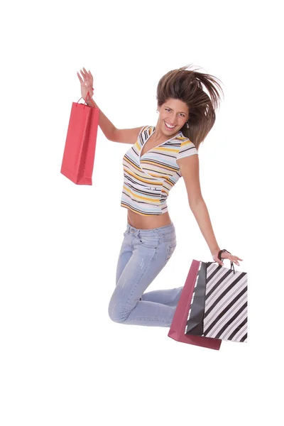 Mujer saltando con bolsas de compras — Foto de Stock