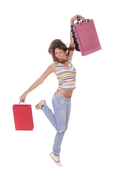 Mulher pulando com sacos de compras — Fotografia de Stock