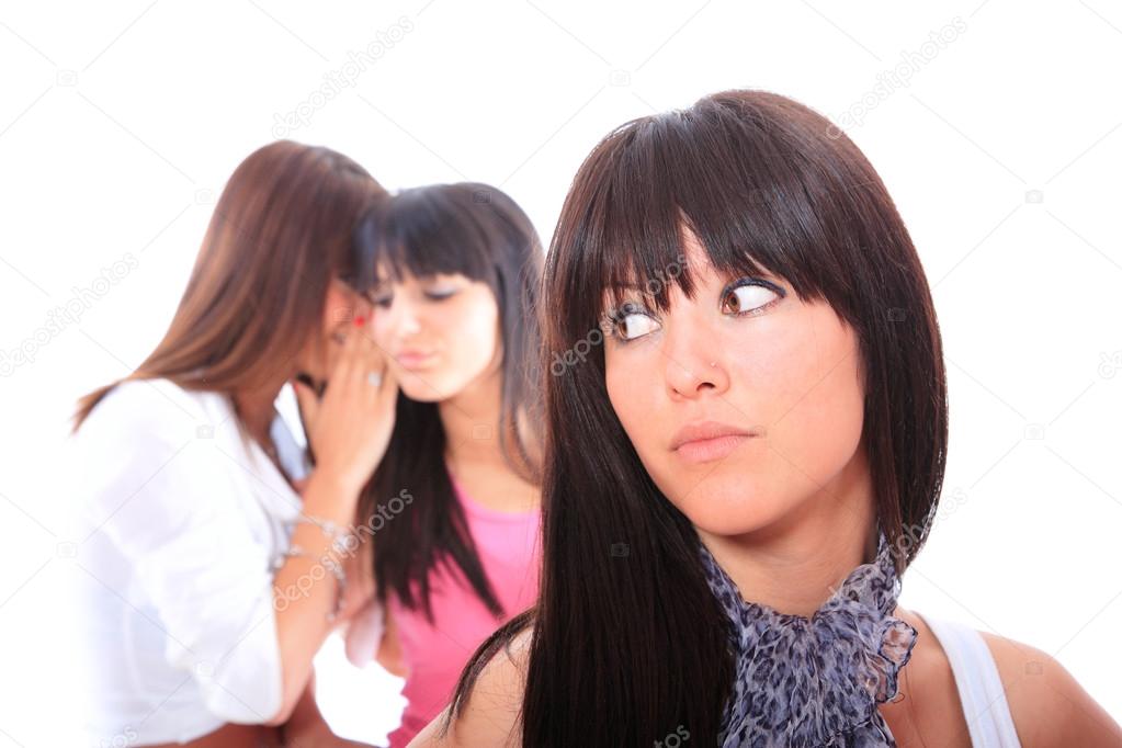 Three attractive girls gossiping