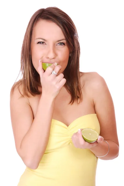 Happy model eating Lime — Stock Photo, Image