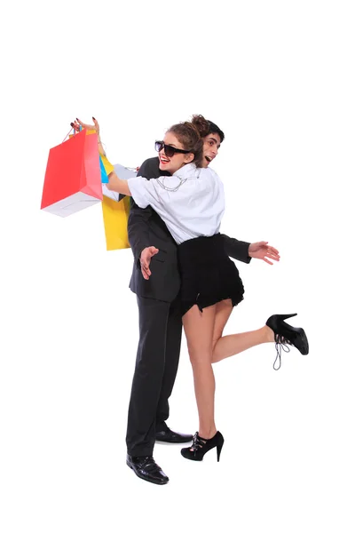 Pareja de compras sonriendo. Aislado sobre fondo blanco —  Fotos de Stock