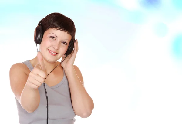 Exy mujer joven con auriculares —  Fotos de Stock