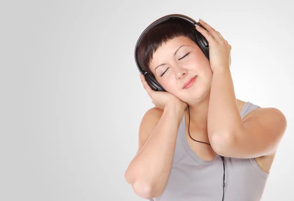 Exy junge Frau mit Kopfhörern — Stockfoto