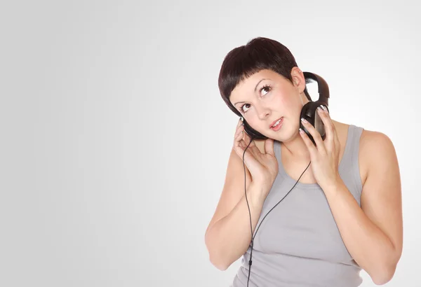 Exy young woman with headphones — Stock Photo, Image