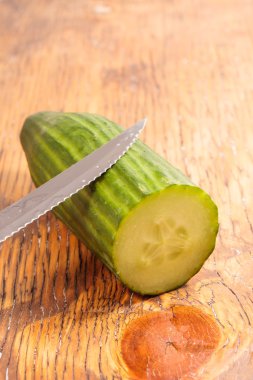 Big cucumber on a wood table