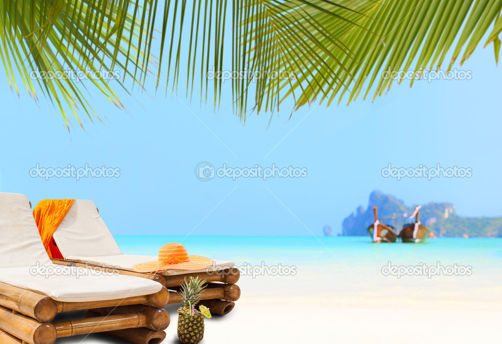Straw hat on sunbed on the beach