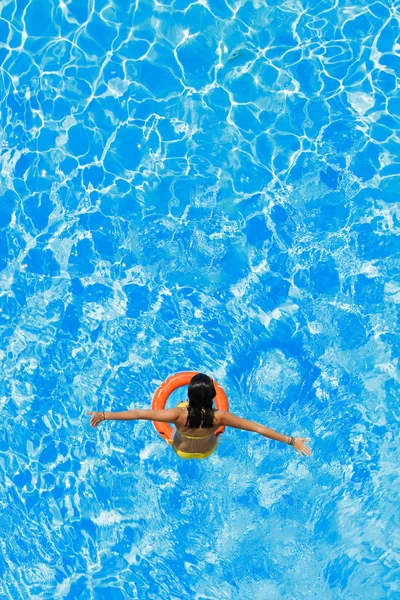 Jumping in the buoy at the swimming pool — Stock Photo, Image