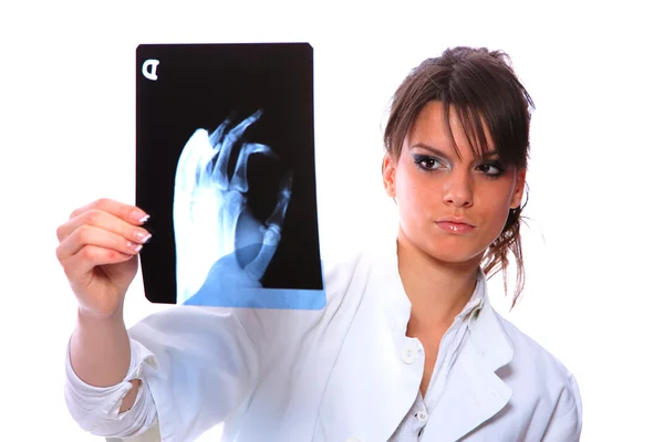 Female doctor looking at an x-ray — Stock Photo, Image