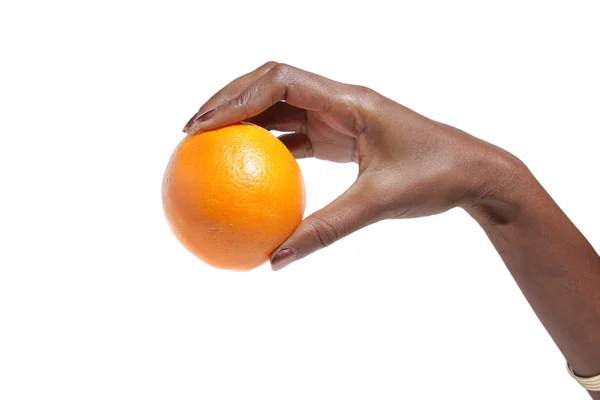 African American Elegant female hand holding a orange — Stock Photo, Image