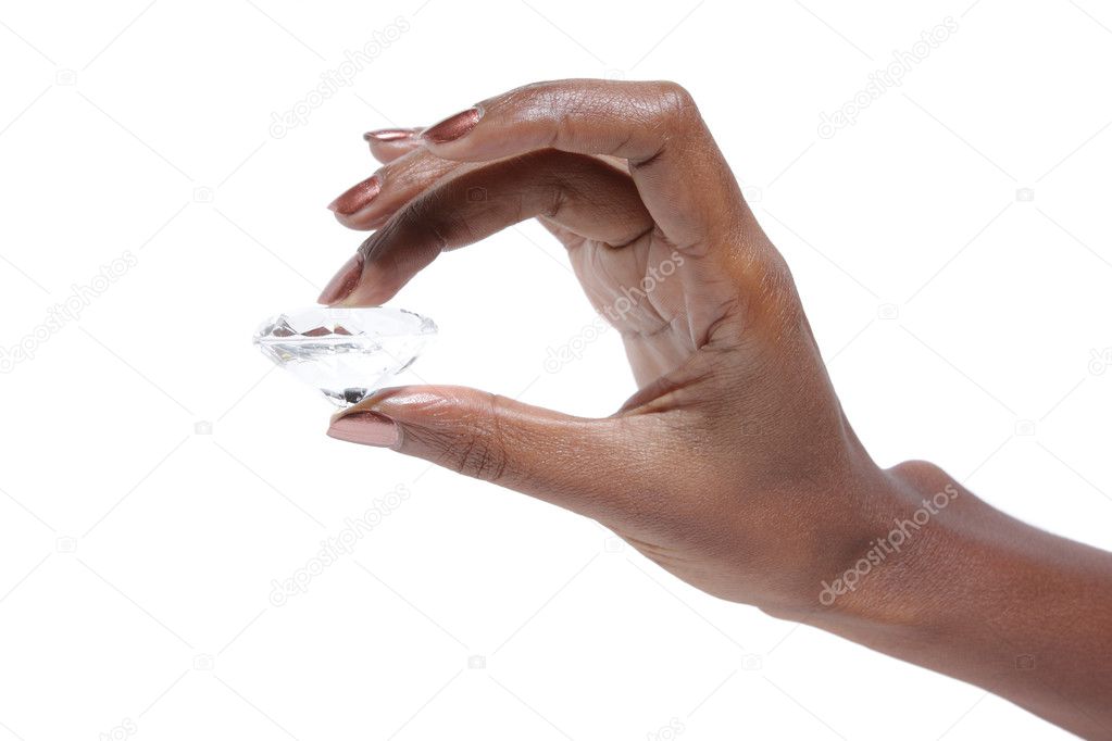 African American Female hand holding diamond