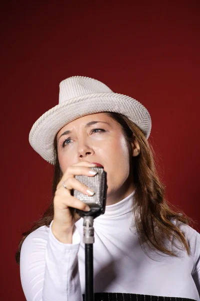 Sexy singer with a vintage microphone — Stock Photo, Image