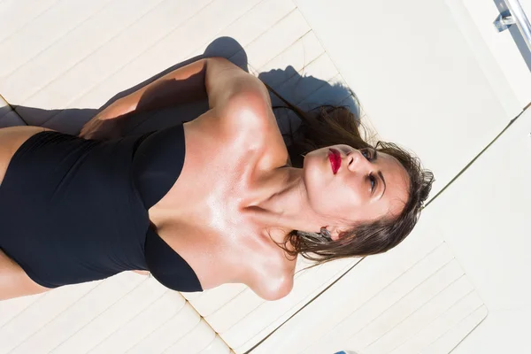 Young woman on her private yacht — Stock Photo, Image