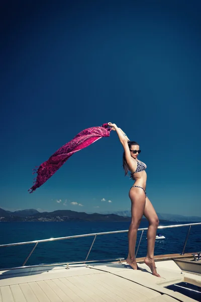 Young woman on her private yacht — Stock Photo, Image