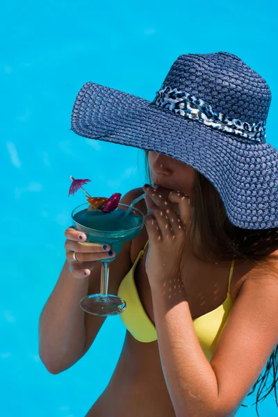 Young woman wearing a straw hat — Stock Photo, Image