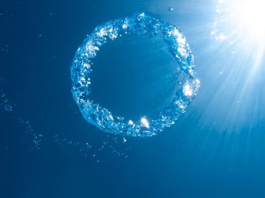 A bubble ring ascends upward clipart